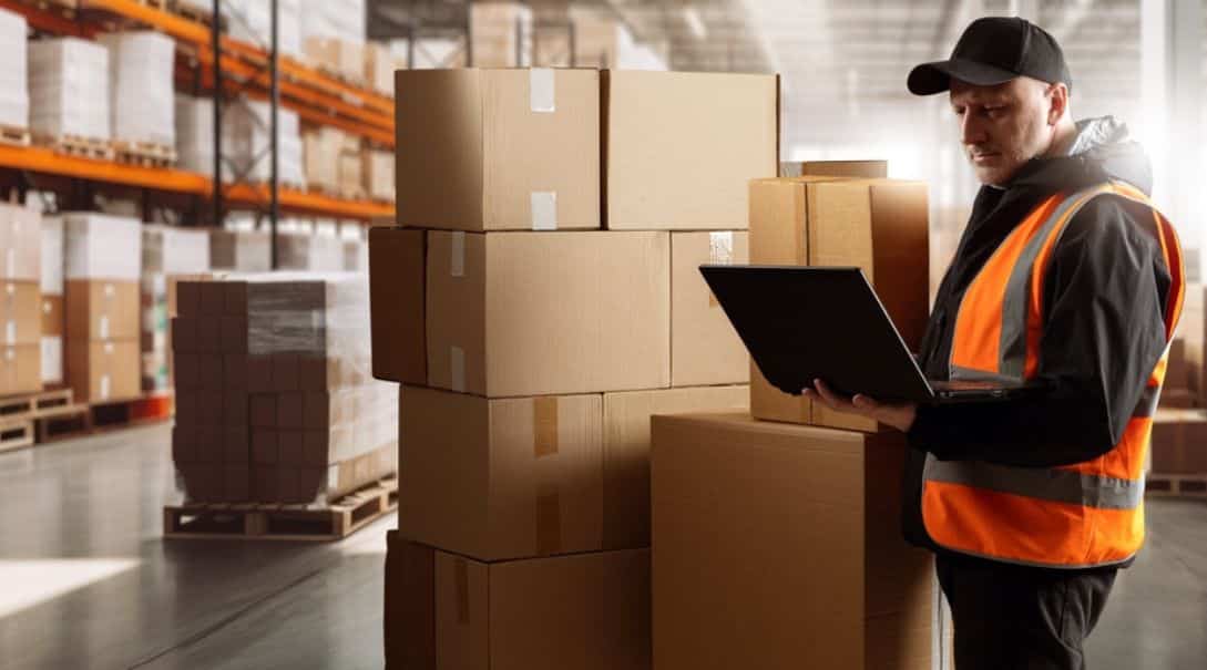 eWorld employee in a fulfillment center job order fulfilling