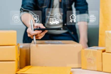 a person writing on a tablet during order fulfillment