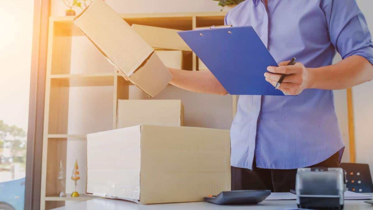 warehouse worker auditing inventory and shipments