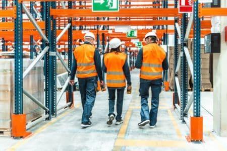 warehouse workers managing inventory in a fulfillment center