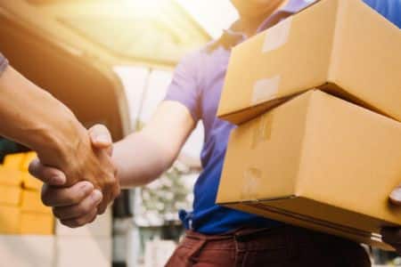 expedited shipping customer handshake with delivery driver