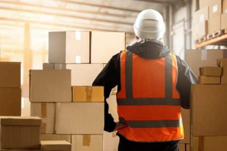 warehouse worker inspecting packages