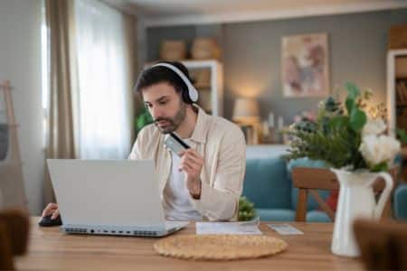 online shopper completing a direct-to-consumer purchase from a home office.